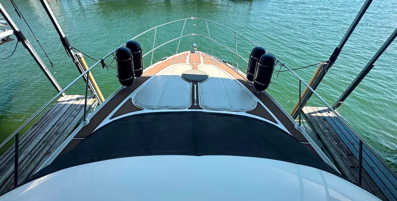 Slide: The Image of 2001 Regal Commodore 3780 yacht deck view on calm water. - 24