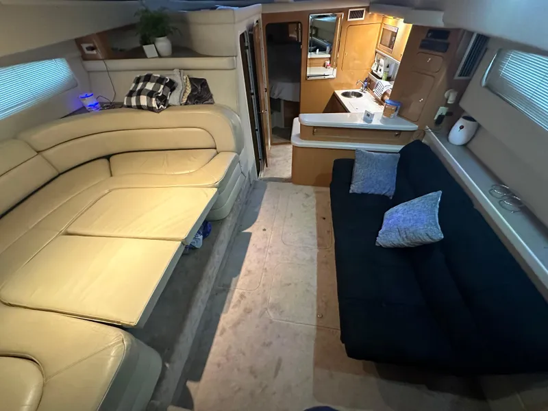 Slide: The Image of Interior of 2001 Regal Commodore 3780 yacht with cozy seating and modern amenities. - 36