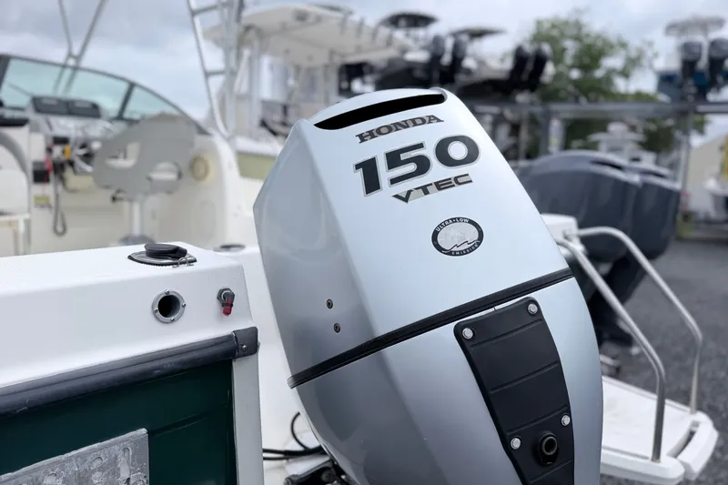 Slide: The Image of Honda 150 VTEC outboard motor on a 2007 Trophy 2002 Walkaround boat. - 6