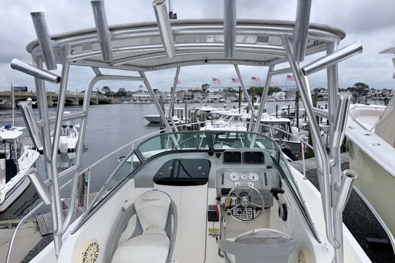 Slide: The Image of 2007 Trophy 2002 Walkaround boat docked at marina with overcast sky. - 12