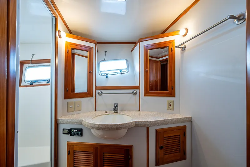Slide: The Image of Kadey-Krogen 58 yacht bathroom, 2001 model, featuring wooden accents and modern fixtures. - 29
