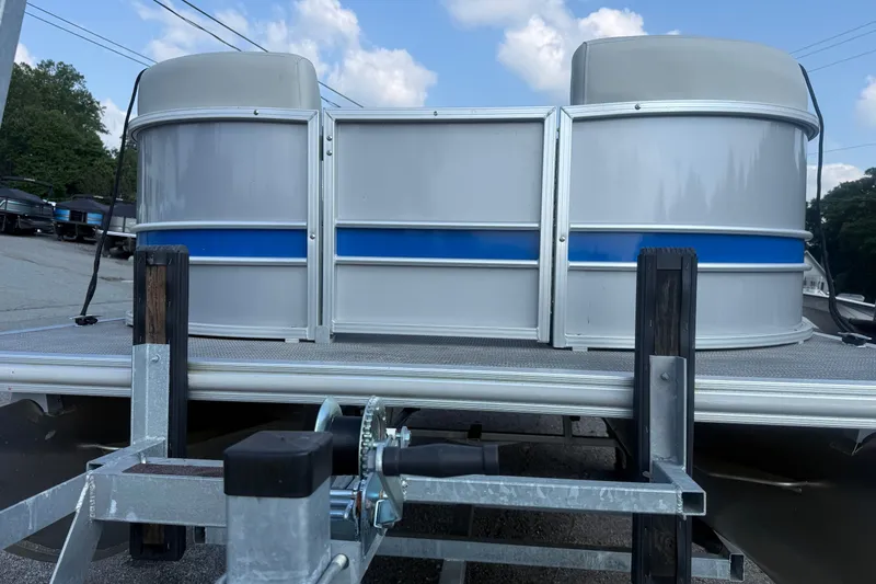 Slide: The Image of 2024 Sylvan Mirage 820 LZ pontoon boat on trailer, featuring sleek design and blue accents. - 17