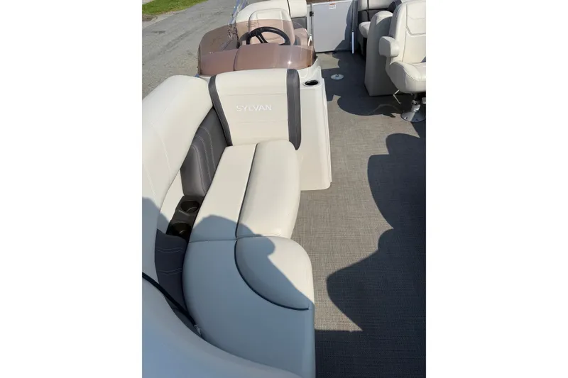 Slide: The Image of 2024 Sylvan Mirage 820 LZ boat interior with plush seating and modern design. - 8