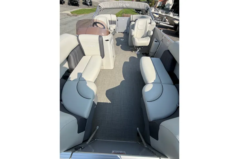 Slide: The Image of 2024 Sylvan Mirage 820 LZ pontoon boat interior with spacious seating and modern design. - 9