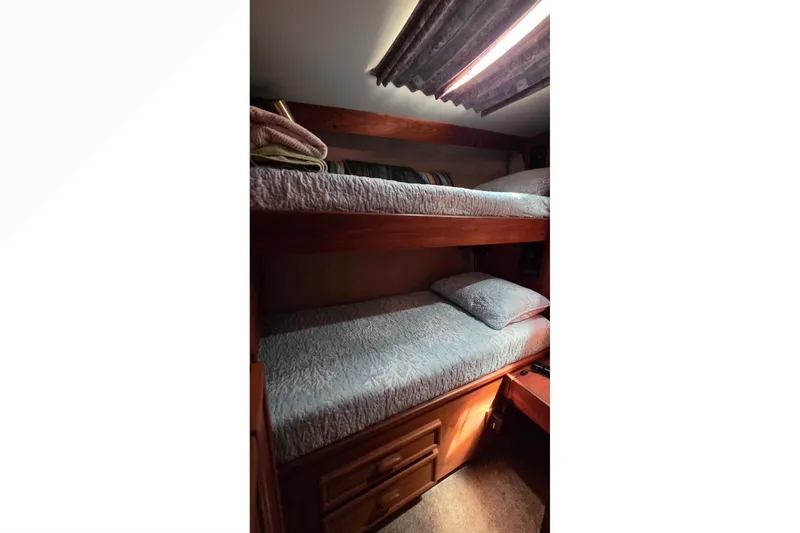 Slide: The Image of Interior of 1989 Jersey 42 Convertible Sportfisherman with cozy bunk beds. - 13
