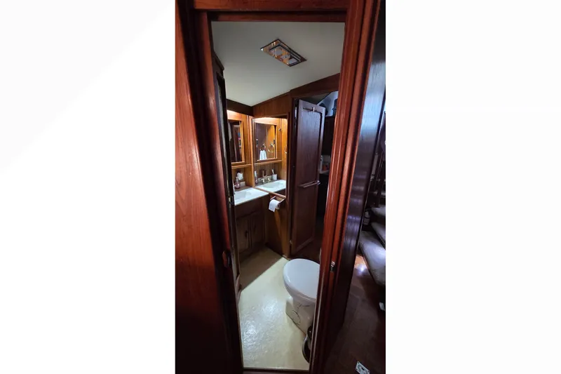 Slide: The Image of Interior view of 1989 Jersey 42 Convertible Sportfisherman bathroom with wooden cabinetry. - 14