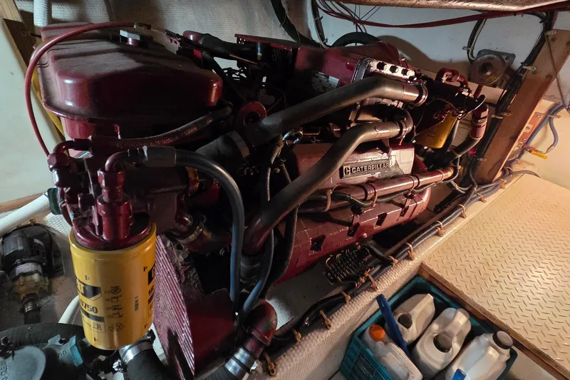 Slide: The Image of Engine room of 1989 Jersey 42 Convertible Sportfisherman with Caterpillar engine and maintenance supplies. - 25