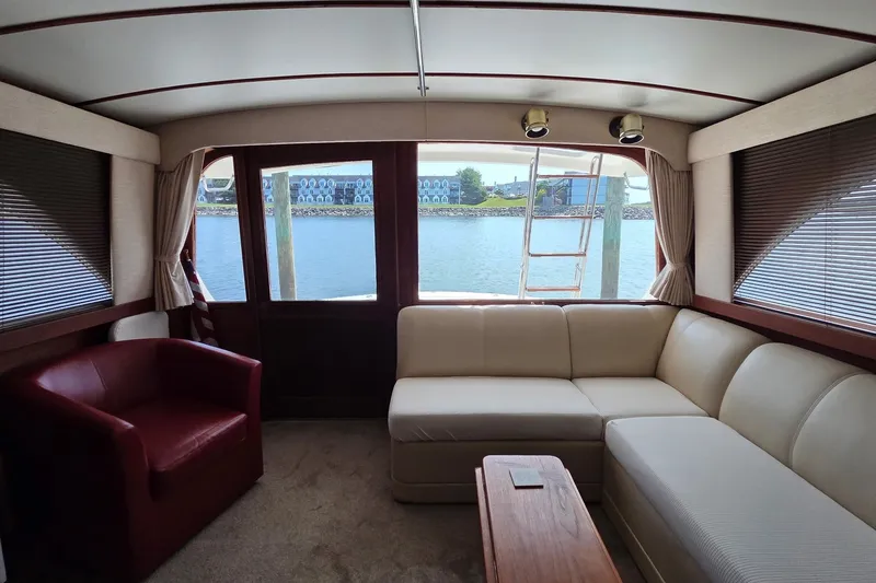 Slide: The Image of Interior of 1989 Jersey 42 Convertible Sportfisherman with beige seating and water view. - 7