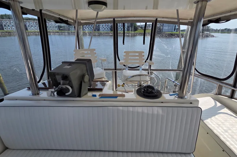 Slide: The Image of 1989 Jersey 42 Convertible Sportfisherman helm with steering wheel and navigation equipment. - 18