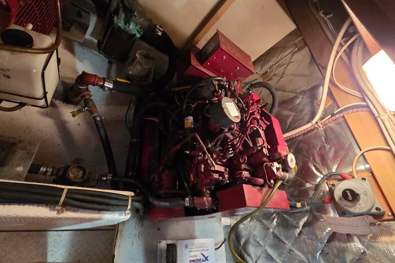 Slide: The Image of Engine room of 1989 Jersey 42 Convertible Sportfisherman with visible machinery and wiring. - 27