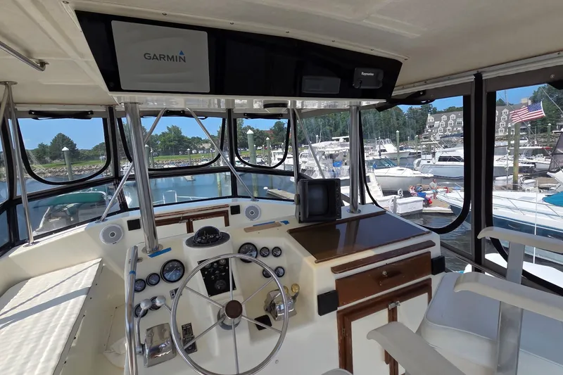 Slide: The Image of Cockpit of 1989 Jersey 42 Convertible Sportfisherman with Garmin navigation, docked at marina. - 17