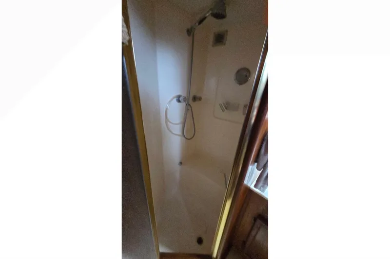 Slide: The Image of Shower area inside 1989 Jersey 42 Convertible Sportfisherman boat, featuring modern fixtures. - 15