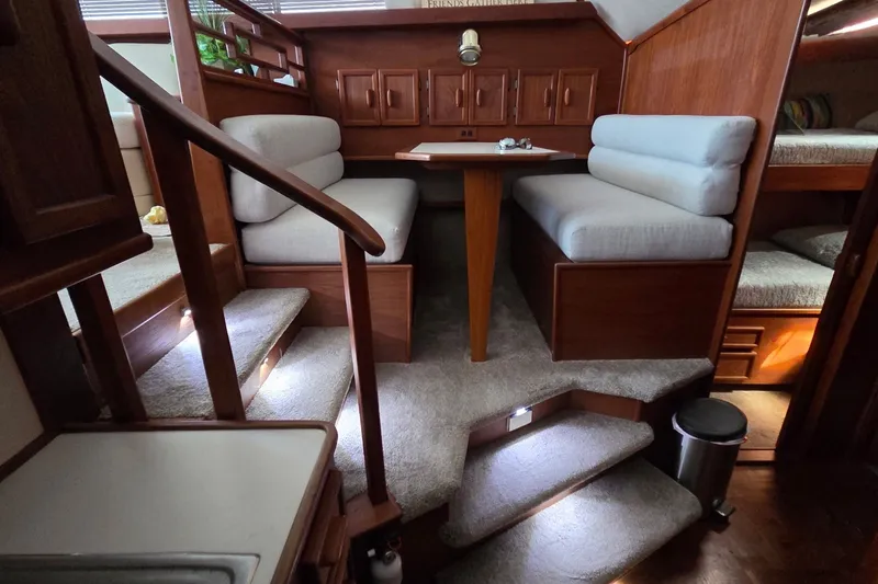 Slide: The Image of Interior of 1989 Jersey 42 Convertible Sportfisherman with cozy seating and wooden accents. - 10