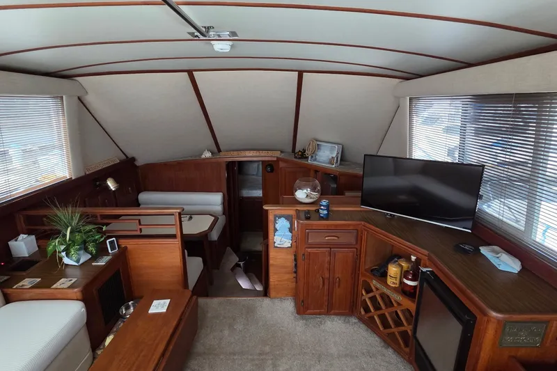 Slide: The Image of Interior of 1989 Jersey 42 Convertible Sportfisherman with cozy seating and modern amenities. - 8