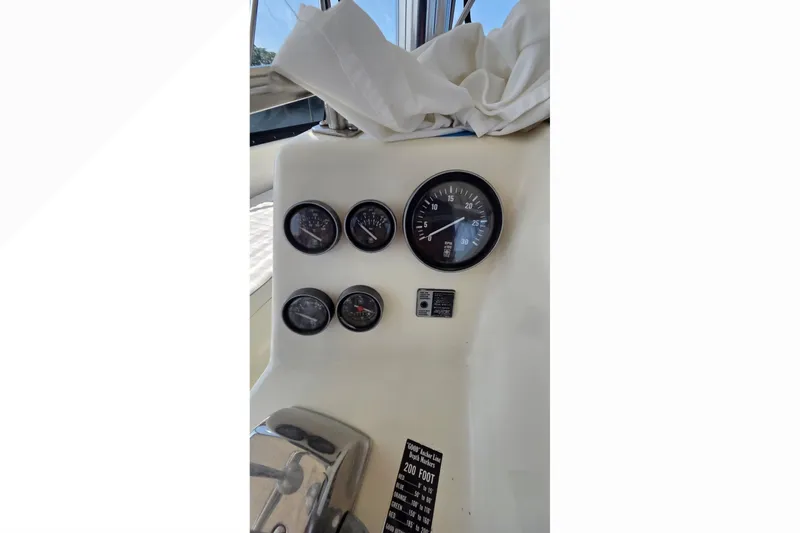 Slide: The Image of Dashboard of a 1989 Jersey 42 Convertible Sportfisherman with gauges and controls. - 22