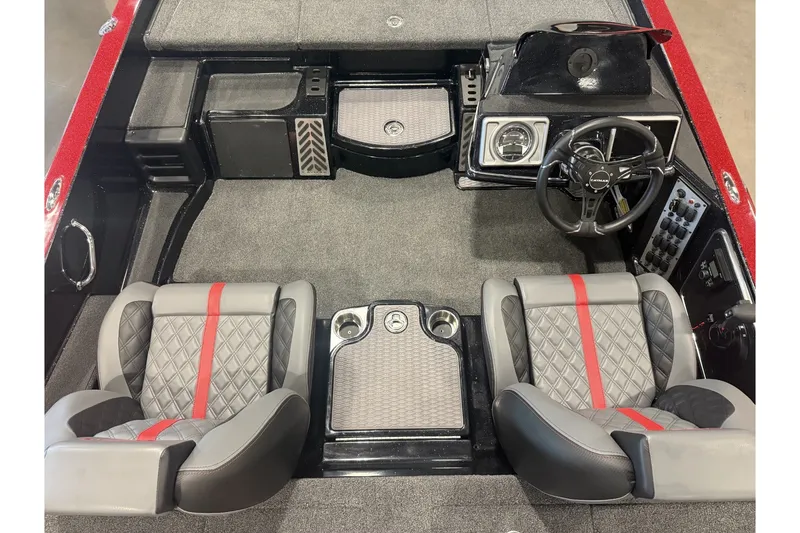 Slide: The Image of 2027 Caymas 201 Pro boat interior with gray and red seats, steering wheel, and dashboard. - 6