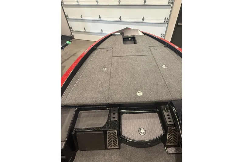 Slide: The Image of 2027 Caymas 201 Pro boat interior with spacious deck and storage compartments. - 5