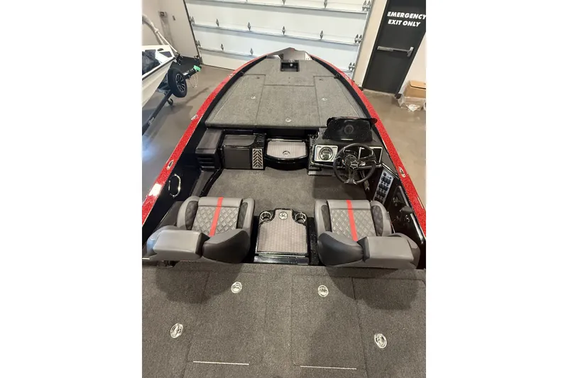 Slide: The Image of 2027 Caymas 201 Pro boat interior with dual seats and steering console. - 7