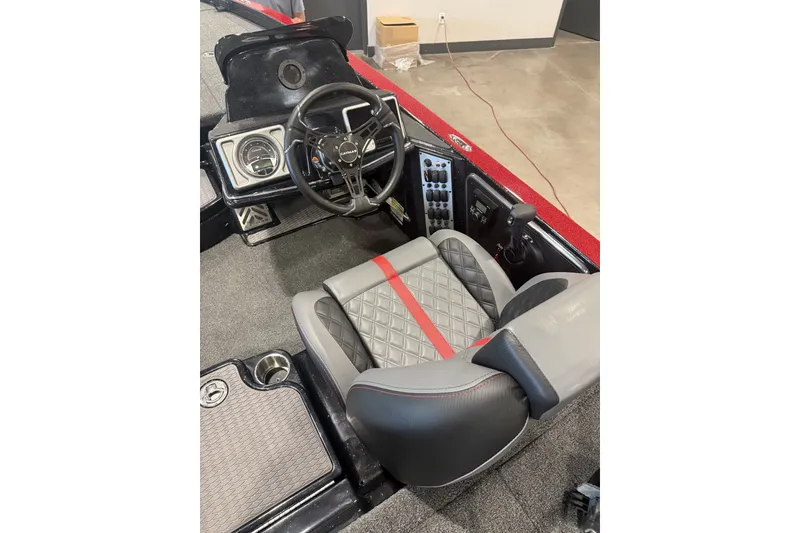 Slide: The Image of Interior of 2027 Caymas 201 Pro boat with modern steering and quilted seat design. - 3