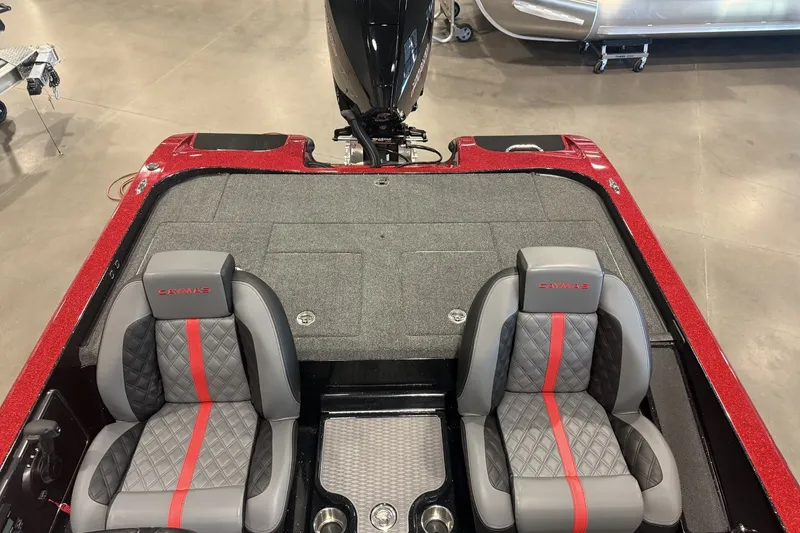 Slide: The Image of 2027 Caymas 201 Pro boat interior with gray and red seats, spacious deck. - 4
