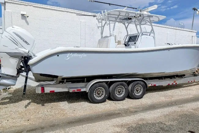 Slide: The Image of 2022 Yellowfin 36 Offshore boat on trailer, parked outdoors. - 1