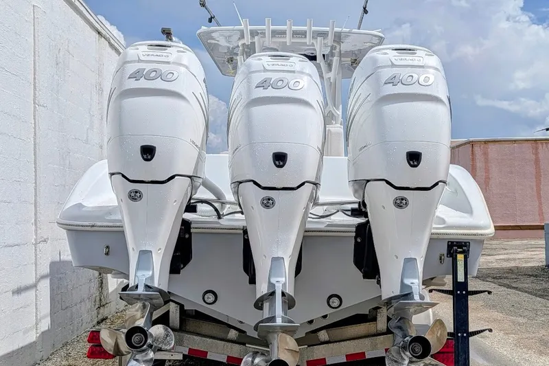 Slide: The Image of 2022 Yellowfin 36 Offshore boat with triple 400 horsepower engines. - 2