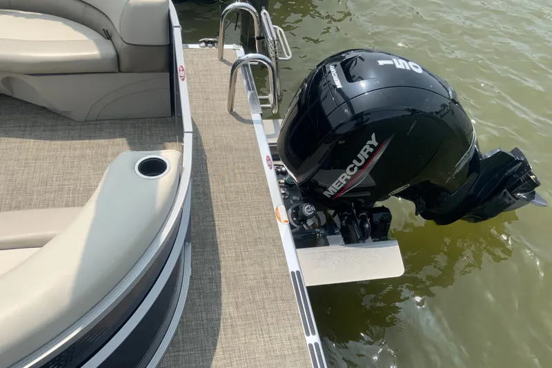 Slide: The Image of 2023 Cypress Cay Seabreeze 232 pontoon boat with Mercury engine on water. - 7