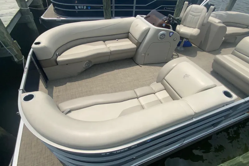 Slide: The Image of 2023 Cypress Cay Seabreeze 232 pontoon boat with luxurious seating and modern helm. - 6