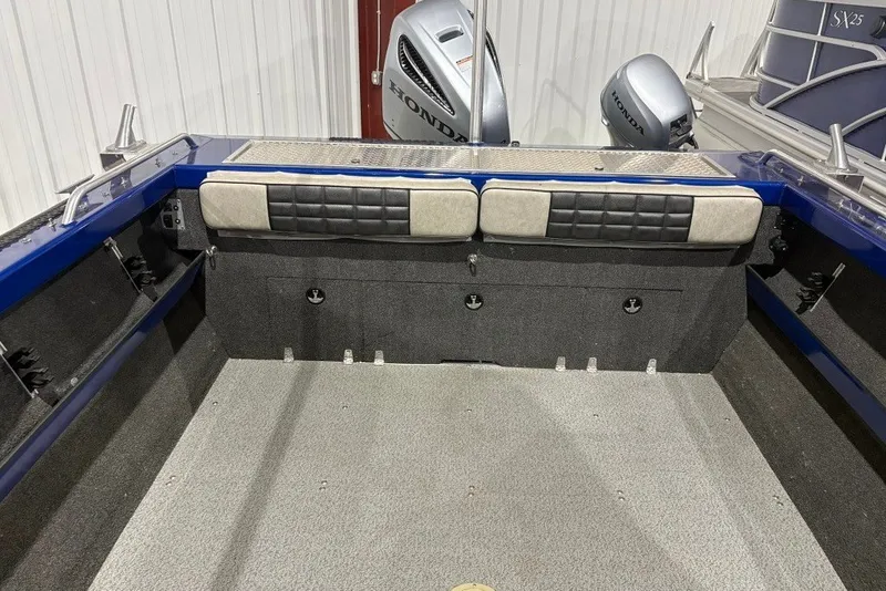 Slide: The Image of 2013 Northwest Boats 228 Lightning Outboard interior with Honda engines, featuring cushioned seating. - 15