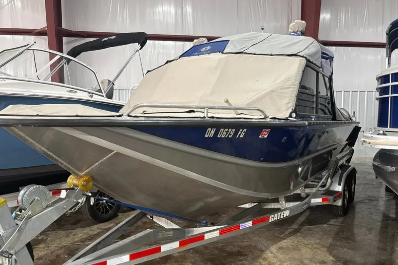 Slide: The Image of 2013 Northwest Boats 228 Lightning Outboard on trailer in indoor storage. - 4
