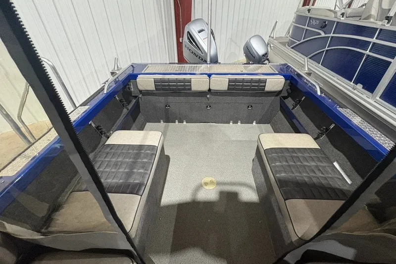 Slide: The Image of 2013 Northwest Boats 228 Lightning Outboard interior with seating and Honda outboard motors. - 12