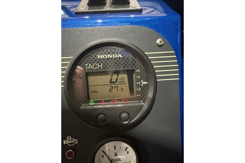 Slide: The Image of Honda tachometer on 2013 Northwest Boats 228 Lightning Outboard, displaying 27 hours. - 21