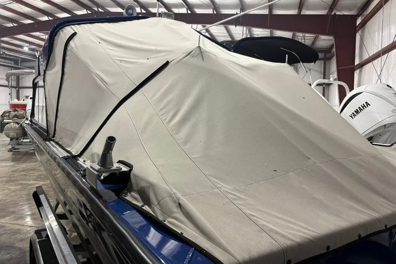 Slide: The Image of 2013 Northwest Boats 228 Lightning Outboard covered in storage, featuring Yamaha outboard motor. - 18