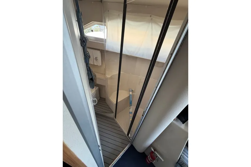 Slide: The Image of 1989 Carver 340 Santego boat bathroom interior with shower and toilet. - 27