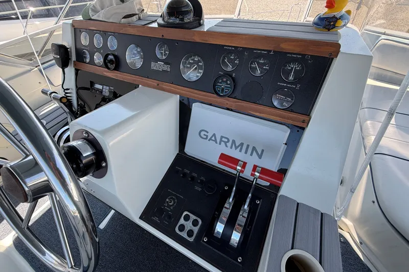 Slide: The Image of Control panel of a 1989 Carver 340 Santego boat with Garmin navigation system. - 16