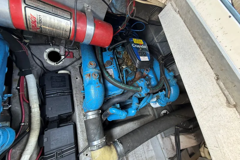 Slide: The Image of Engine compartment of a 1989 Carver 340 Santego with Crusader 454 engine and fire extinguisher. - 30