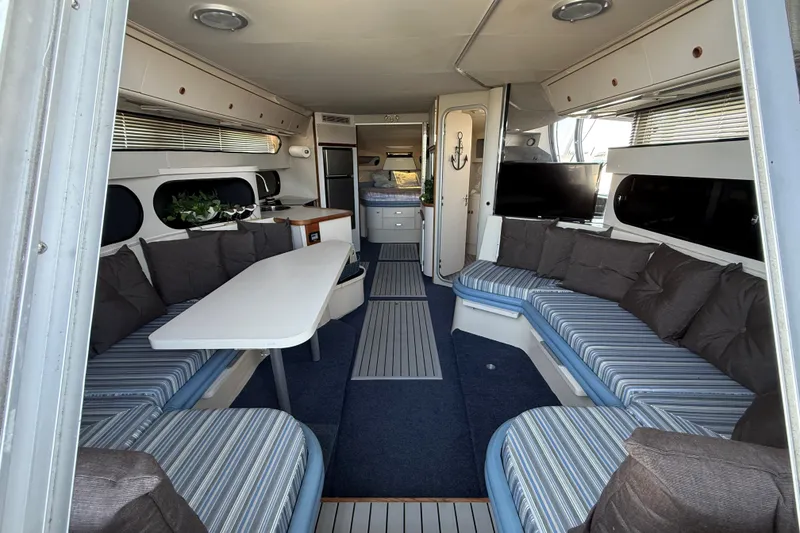 Slide: The Image of Interior of 1989 Carver 340 Santego yacht with spacious seating and modern amenities. - 19