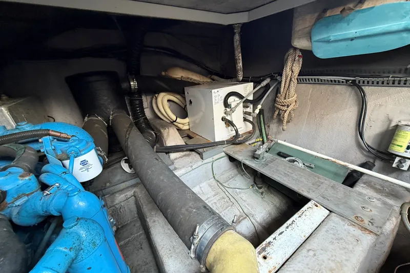 Slide: The Image of Engine room of a 1989 Carver 340 Santego boat, showcasing mechanical components. - 31