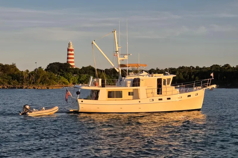 The Image of 2010 Kadey-Krogen 48 North Sea yacht near a lighthouse. - 0