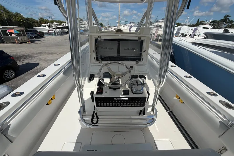 Slide: The Image of 2007 Contender 33 Tournament boat cockpit with Garmin navigation system and steering wheel. - 3