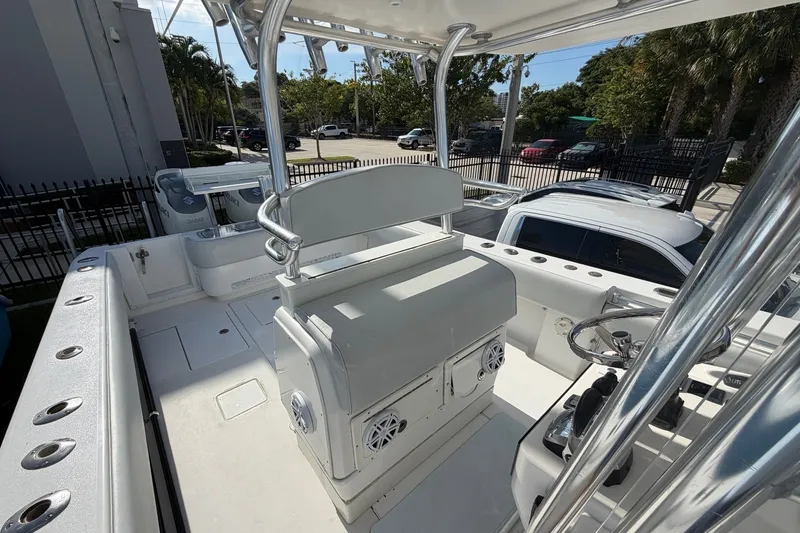Slide: The Image of 2007 Contender 33 Tournament boat interior with helm, seating, and rod holders. - 6