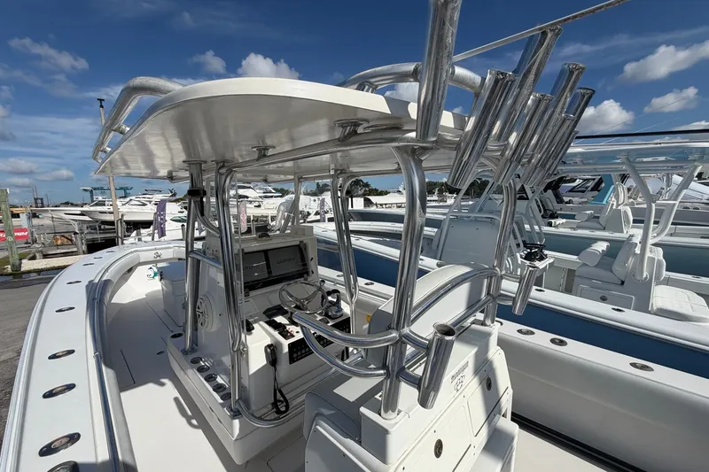Slide: The Image of 2007 Contender 33 Tournament boat with advanced navigation equipment, docked under a clear blue sky. - 5