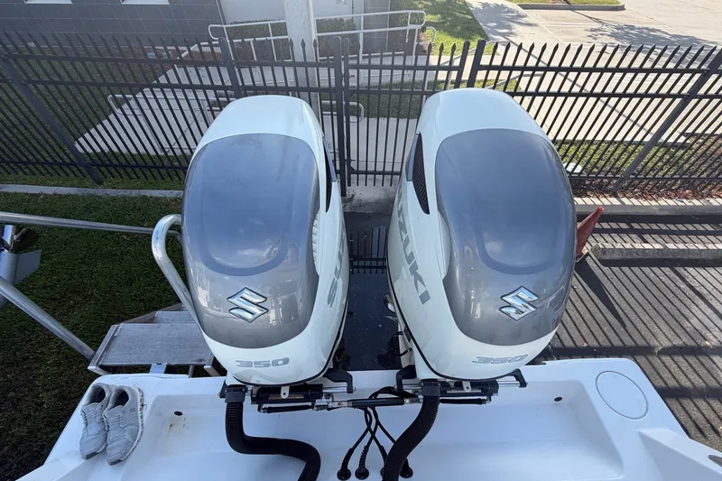 Slide: The Image of Twin Suzuki 350 outboard engines on a 2007 Contender 33 Tournament boat. - 12