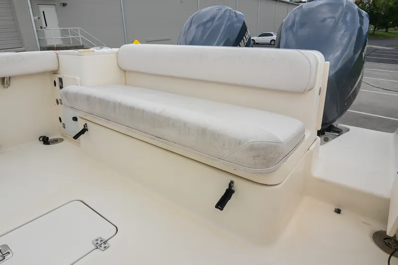 Slide: The Image of 2007 Pursuit OS 285 Offshore boat with cushioned seating and dual Yamaha engines. - 12