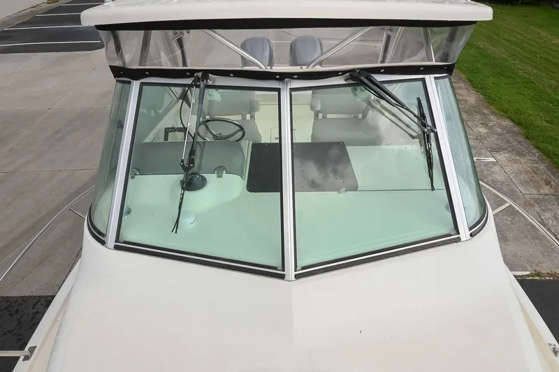 Slide: The Image of 2007 Pursuit OS 285 Offshore boat windshield and cockpit view. - 41