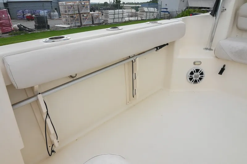 Slide: The Image of 2007 Pursuit OS 285 Offshore boat interior with rod holder and speaker. - 15