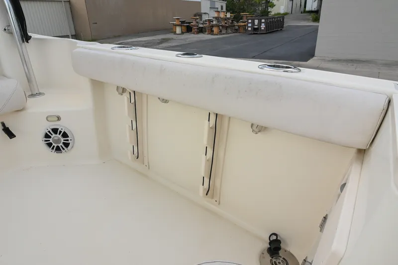 Slide: The Image of 2007 Pursuit OS 285 Offshore boat interior with seating and speaker. - 14
