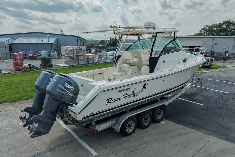 Slide: The Image of 2007 Pursuit OS 285 Offshore boat on trailer with twin Yamaha engines. - 4