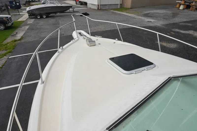 Slide: The Image of 2007 Pursuit OS 285 Offshore boat deck view in a parking area. - 37