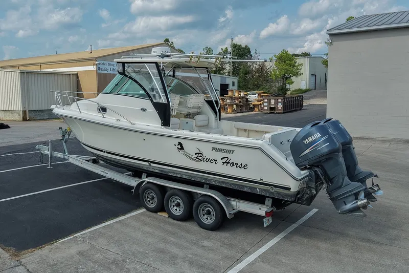 Slide: The Image of 2007 Pursuit OS 285 Offshore boat on trailer with twin Yamaha engines. - 2